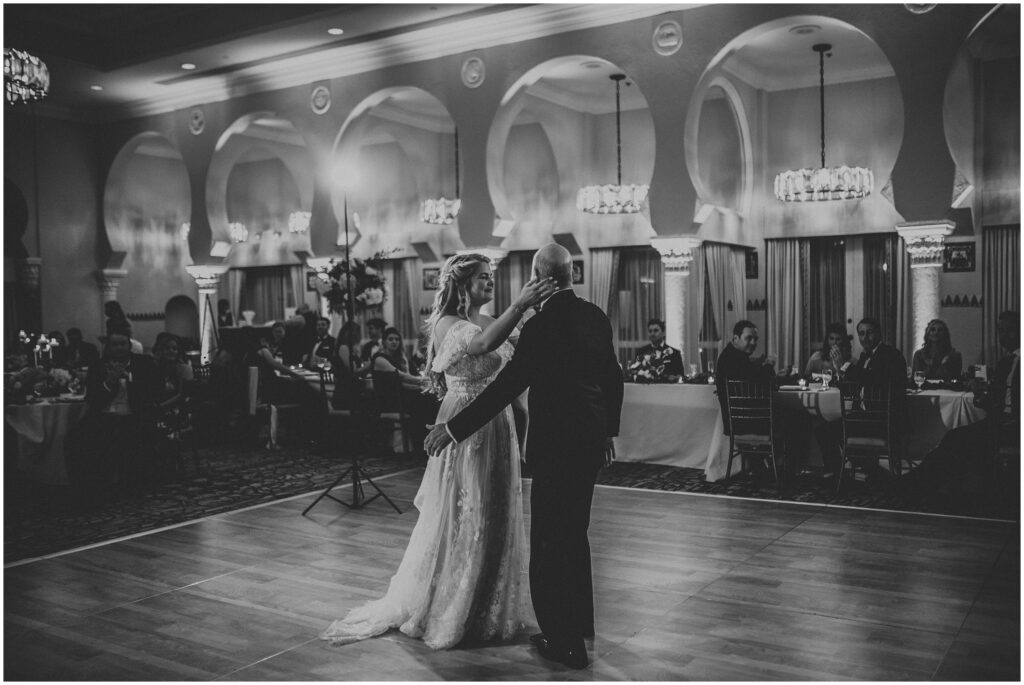 Black-and-white photo of bride and father having father-daughter dance during wedding at The Vinoy 