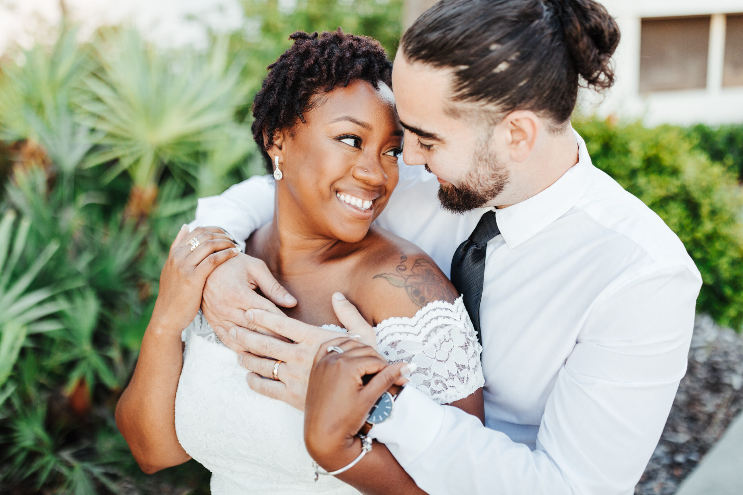 Newlywed couple share an intimate hug after their Tampa courthouse elopement ceremony