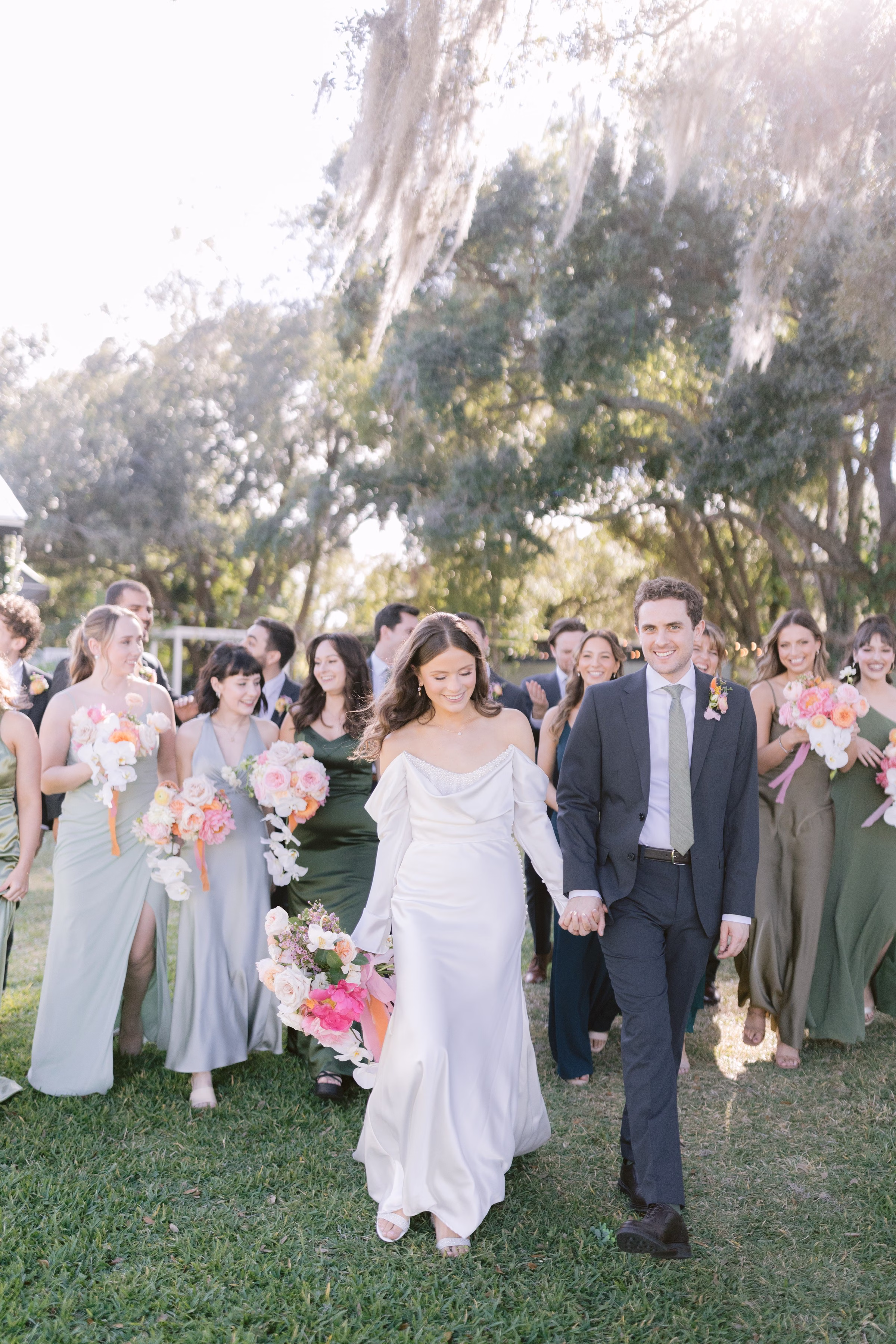 tampa wedding recessional bride groom walking ashley izquierdo photography - Home Newlyweds and bridal party walking during wedding recessional at outdoor Tampa Bay ceremony captured by Ashley Izquierdo Photography