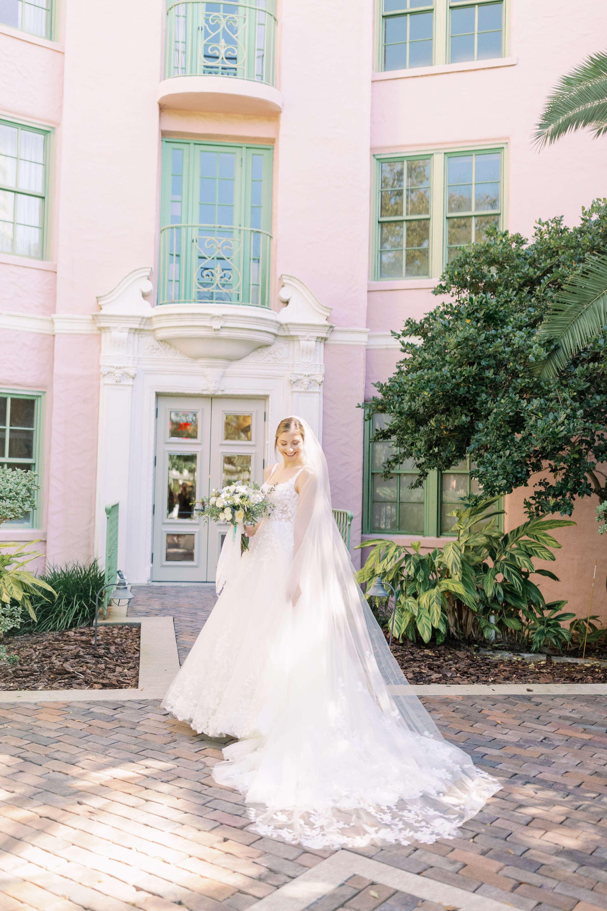 vinoy st pete bridal portrait wedding photography tampa bay - Home Elegant bride in flowing white gown with cathedral veil holding bouquet at Vinoy Renaissance St Petersburg Resort captured by Tampa Bay wedding photographer Ashley Izquierdo Photography