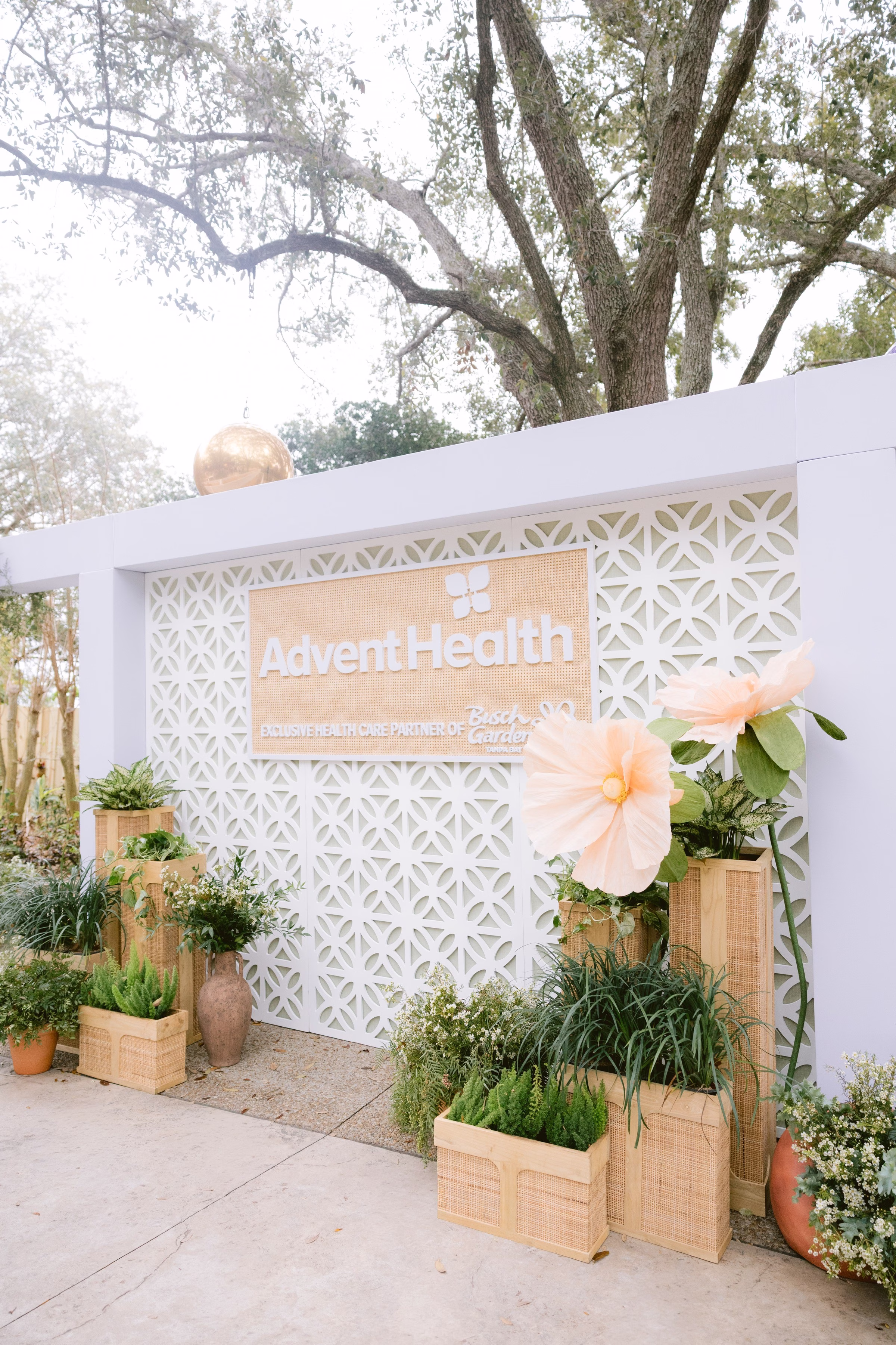 adventhealth birth center entrance sign tampa wedding venue - Home AdventHealth Birth Center entrance sign with decorative lattice wall and wooden planters filled with greenery in Tampa Bay