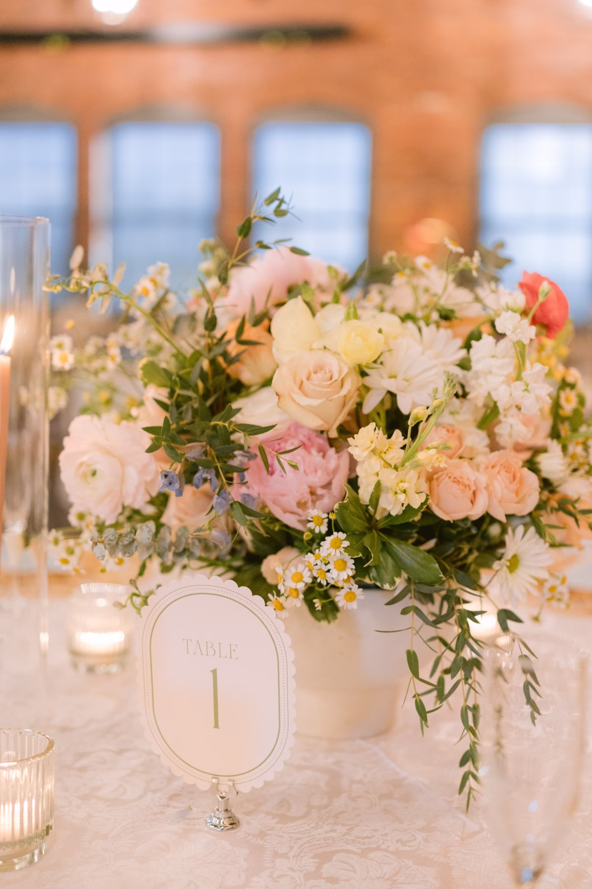 Elegant wedding centerpiece with blush roses and white flowers by I Dew Events florist at Armature Works Tampa wedding