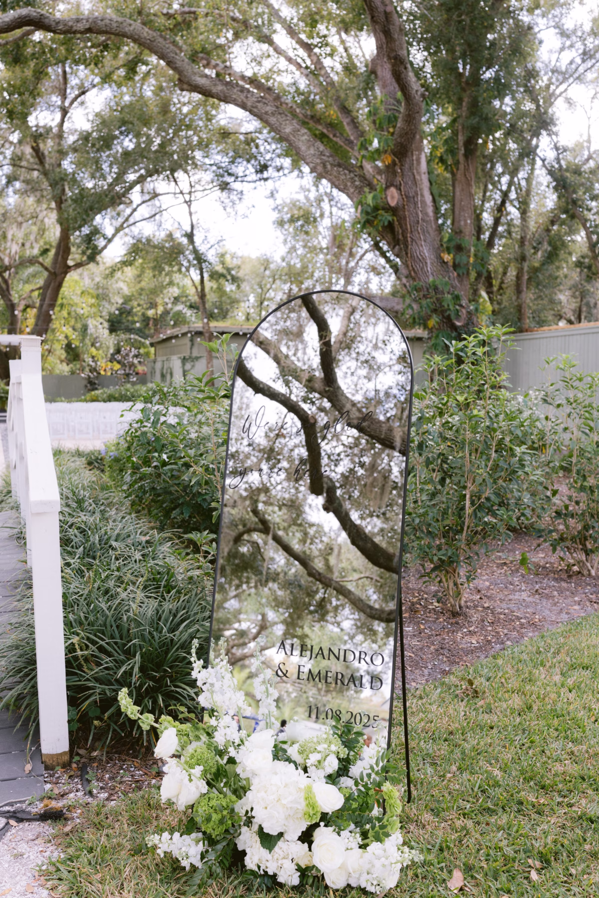 Modern acrylic wedding welcome sign by Ava Elise Decor with white florals at Soire Estate Tampa wedding photographed by Ashley Izquierdo Photography