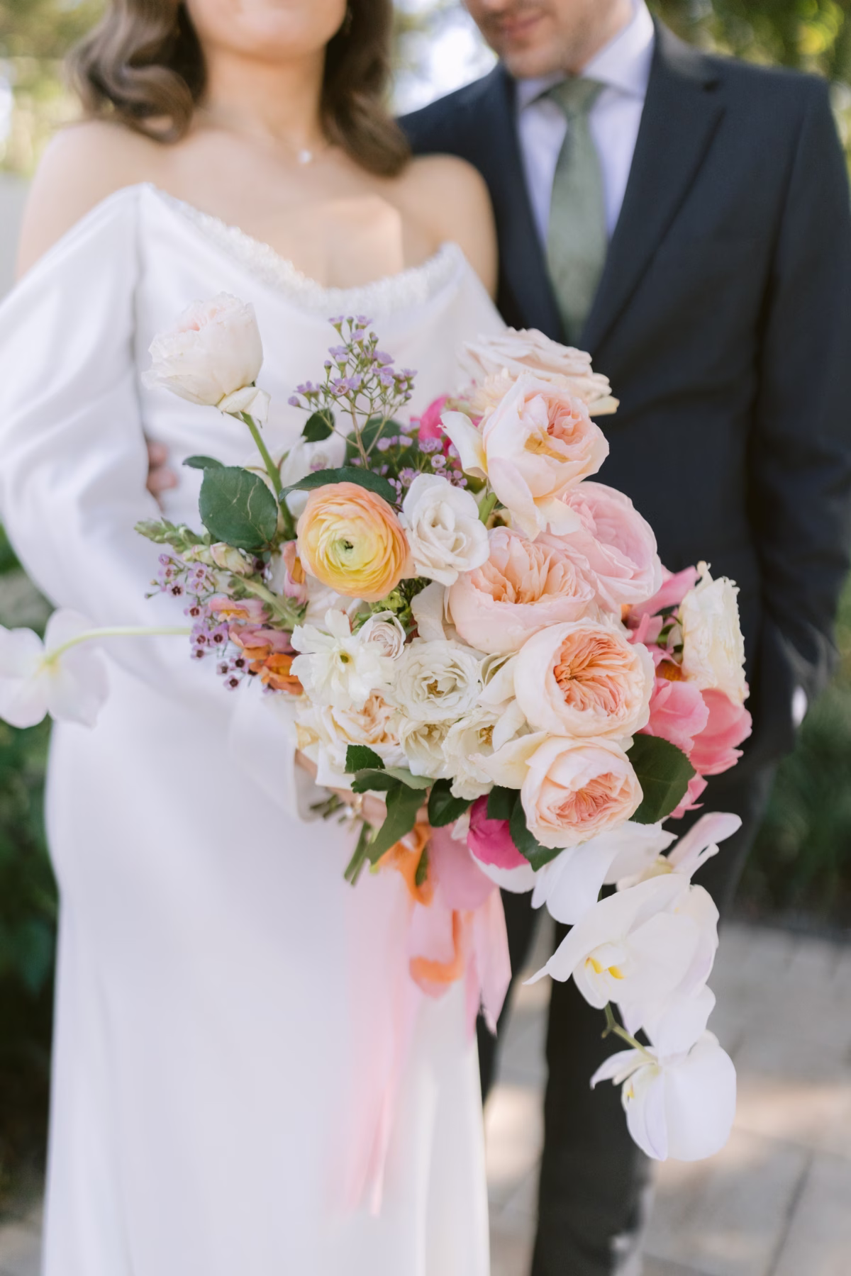 Romantic bridal bouquet with blush roses and ranunculus by Golden Wild Florals at Soire Estate garden wedding photographed by Ashley Izquierdo Photography
