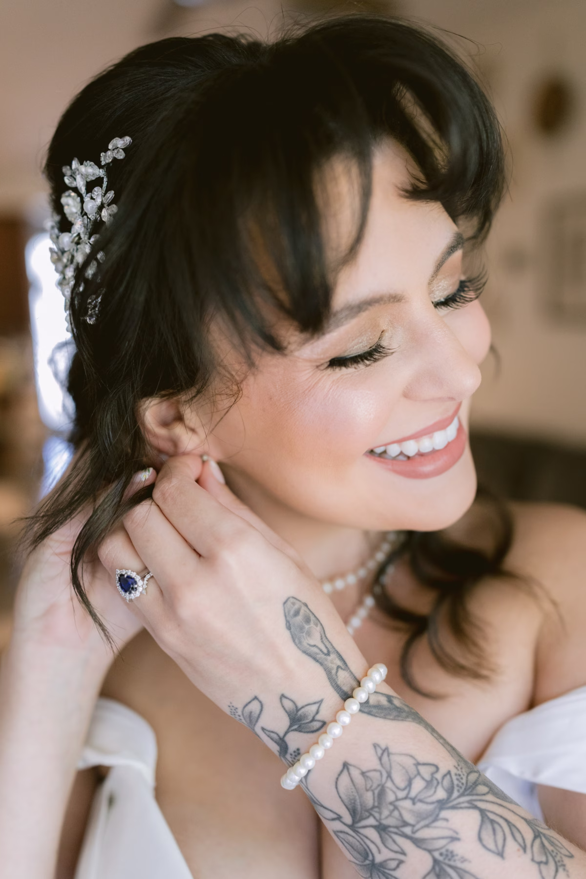Bride with elegant updo and floral hair accessory by Jen Gaffney at Armature Works Tampa wedding