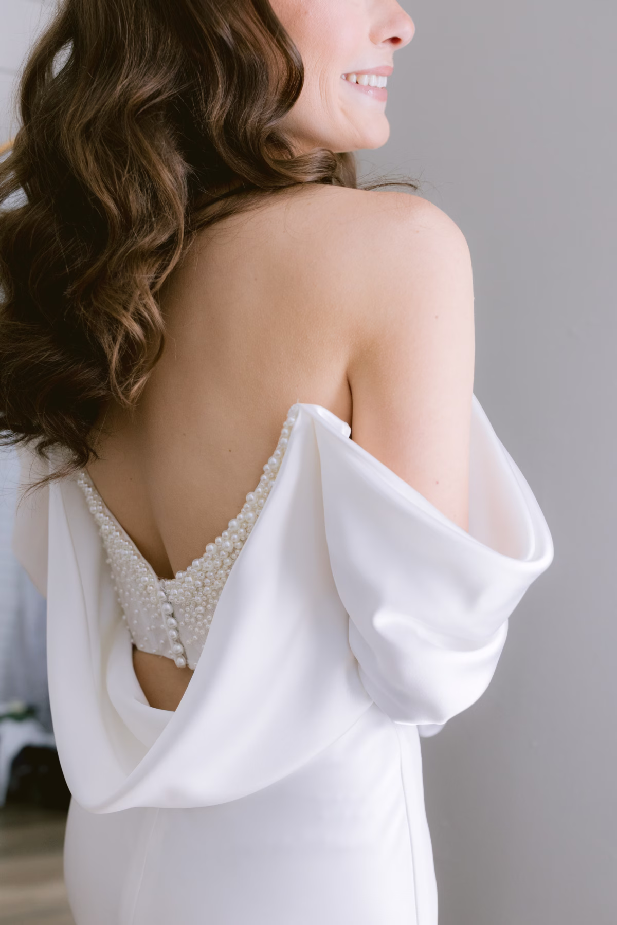 Elegant bridal portrait showcasing White Traditions Bridal House wedding dress with pearl details and flowing sleeves at Soire Estate Tampa garden wedding photographed by Ashley Izquierdo Photography