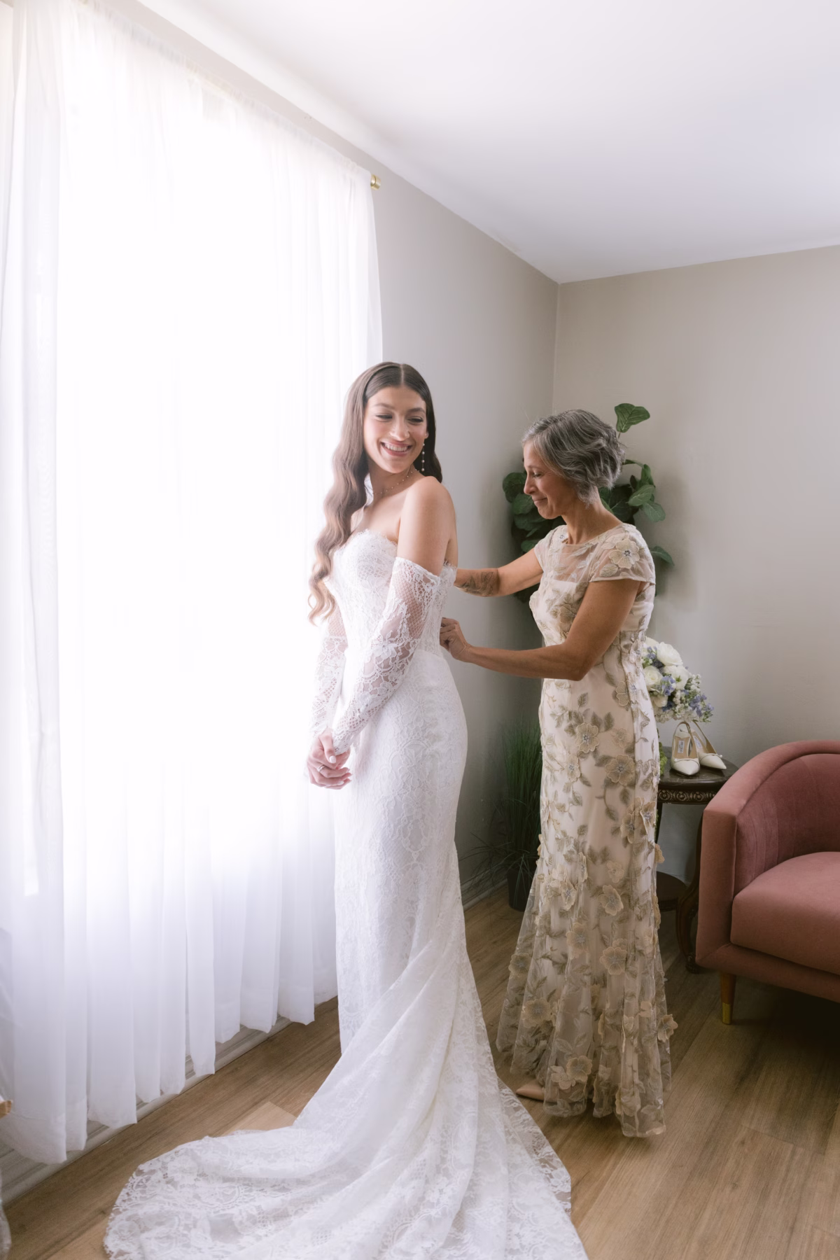 Bride in Ella Blu Bridal wedding dress getting ready with mother at Soire Estate Tampa wedding photographed by Ashley Izquierdo Photography
