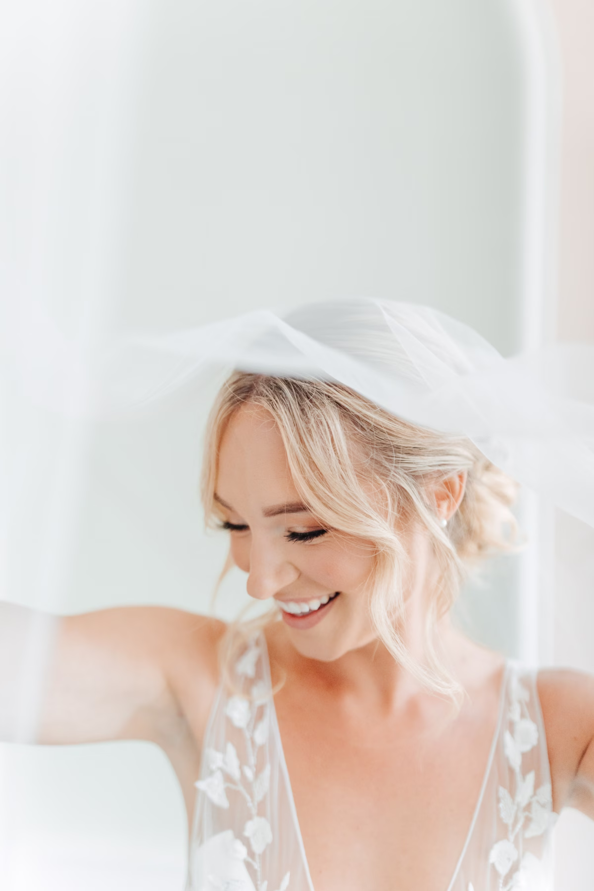 Bride getting ready with hair and makeup by Studio Bride for historic wedding at The Lightner Museum in St Augustine