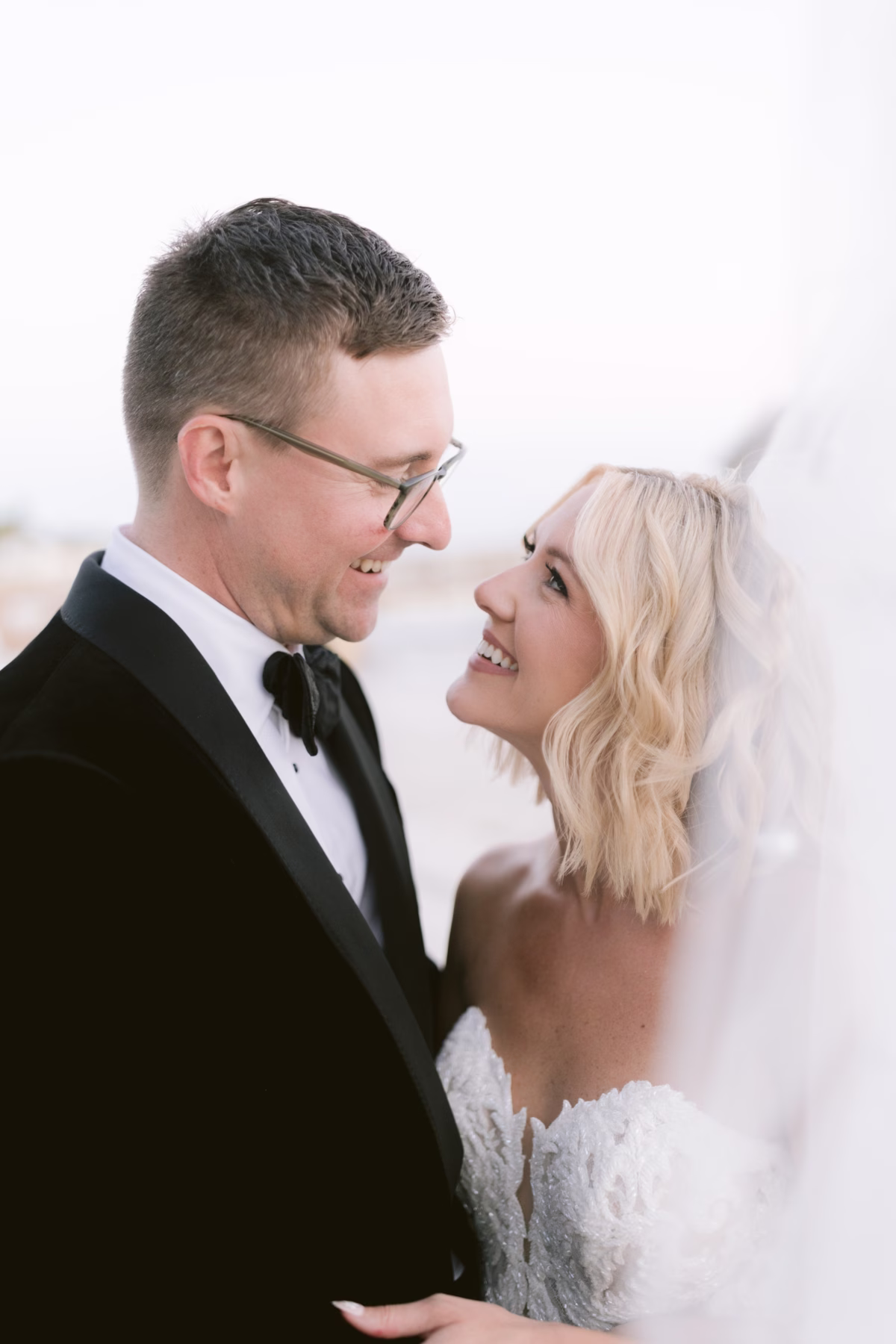 Bride and groom share intimate wedding portrait moment at Casa Marina Key West captured by Ashley Izquierdo Photography
