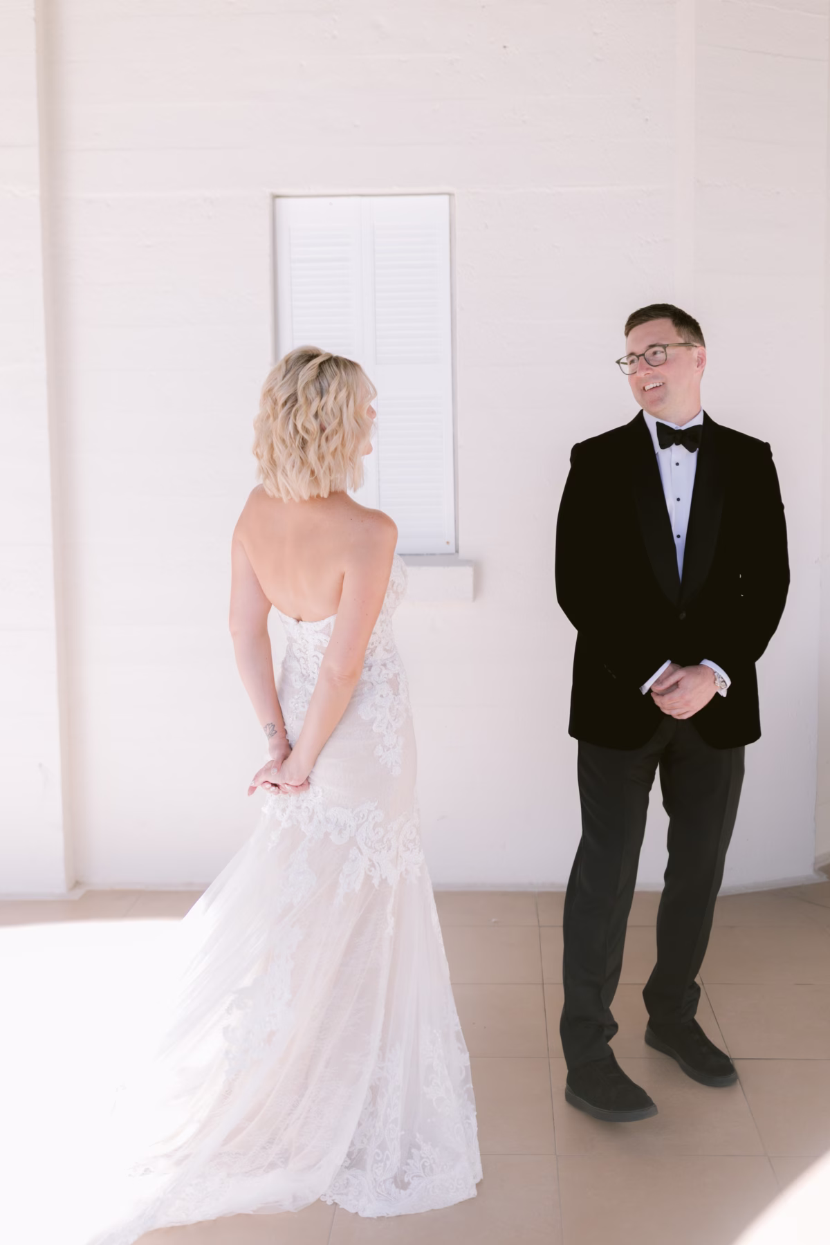 Bride and groom sharing emotional first look moment at Casa Marina Key West wedding venue photographed by Ashley Izquierdo Photography