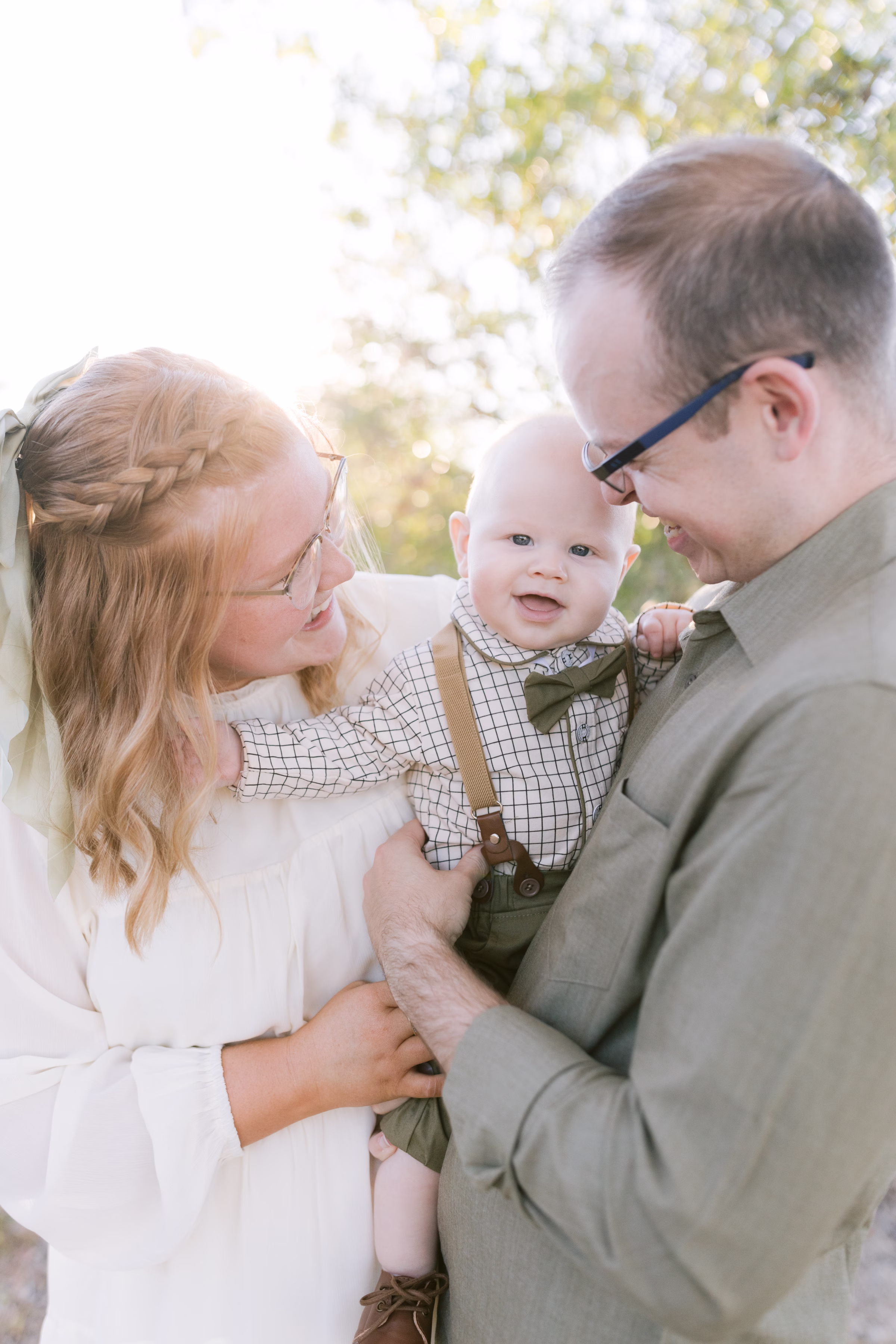 family photos at cypress point park hugging and baby laughing at sunset