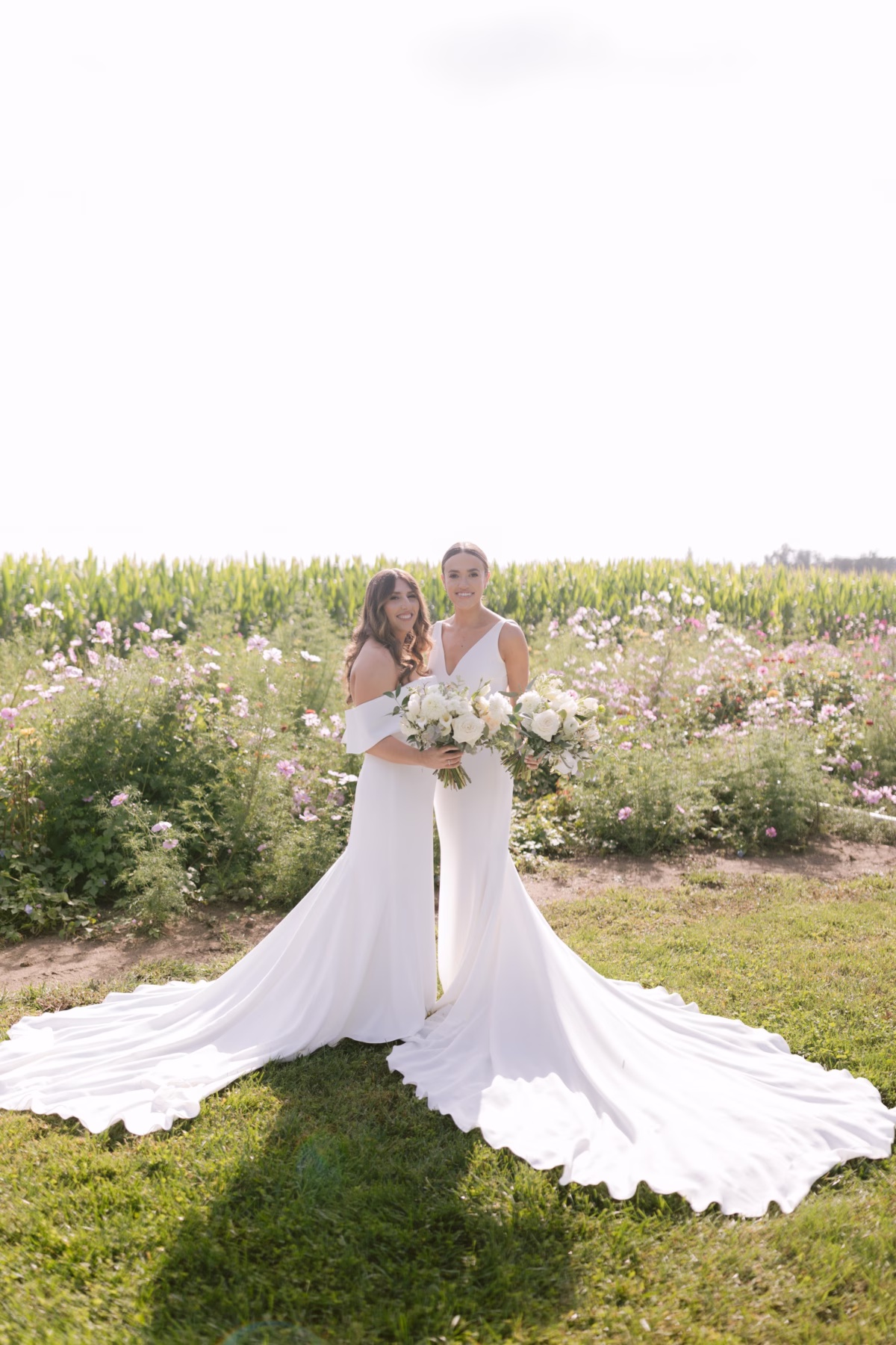 farm wedding brides johnsons locust hall florist allie johnson - A Farm Wedding at Johnson's Locust Hall, New Jersey Two brides in white wedding dresses holding bouquets by Allie Johnson at Johnson's Locust Hall farm wedding venue in New Jersey