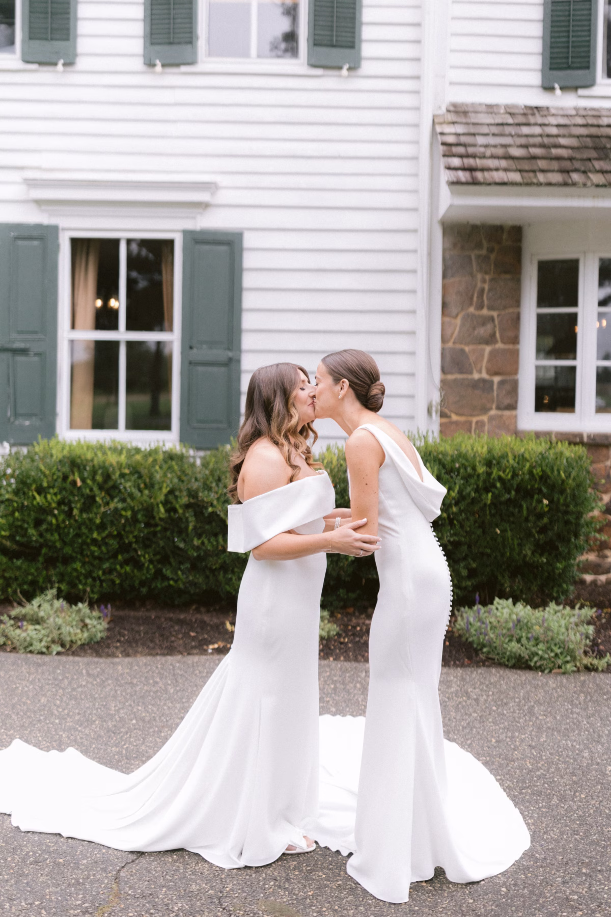 farm wedding johnsons locust hall new jersey brides kiss kleinfeld wedding dresses - A Farm Wedding at Johnson's Locust Hall, New Jersey Two brides in elegant white Kleinfeld wedding gowns share a romantic kiss at their farm wedding at Johnson's Locust Hall in New Jersey