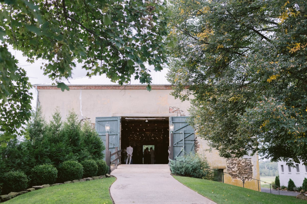 farm wedding venue johnsons locust hall new jersey 1 - A Farm Wedding at Johnson's Locust Hall, New Jersey Rustic barn entrance with blue doors at Johnson's Locust Hall farm wedding venue in New Jersey photographed by Ashley Izquierdo Photography