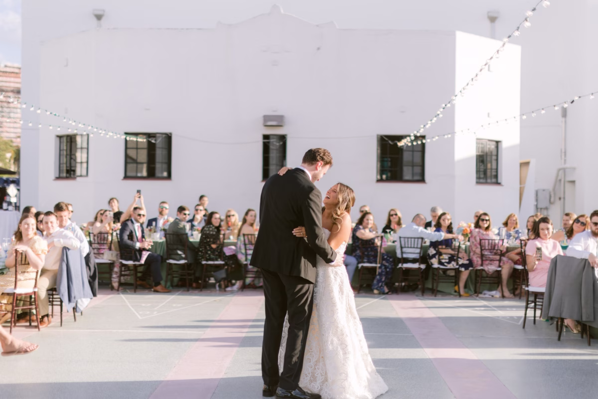Bride and groom sharing their first dance at St Pete Shuffleboard Club wedding planned by Day of Details