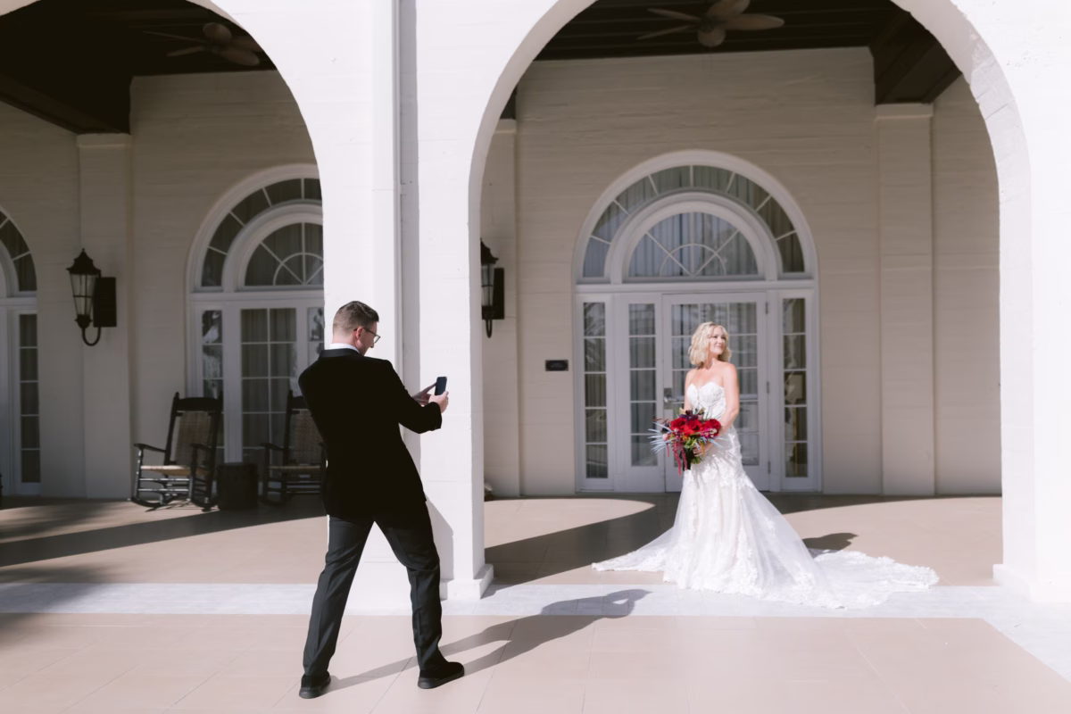 Bride and groom first look moment at Casa Marina Key West with bride holding Arms of Persephone bouquet during Tampa Bay wedding photography session