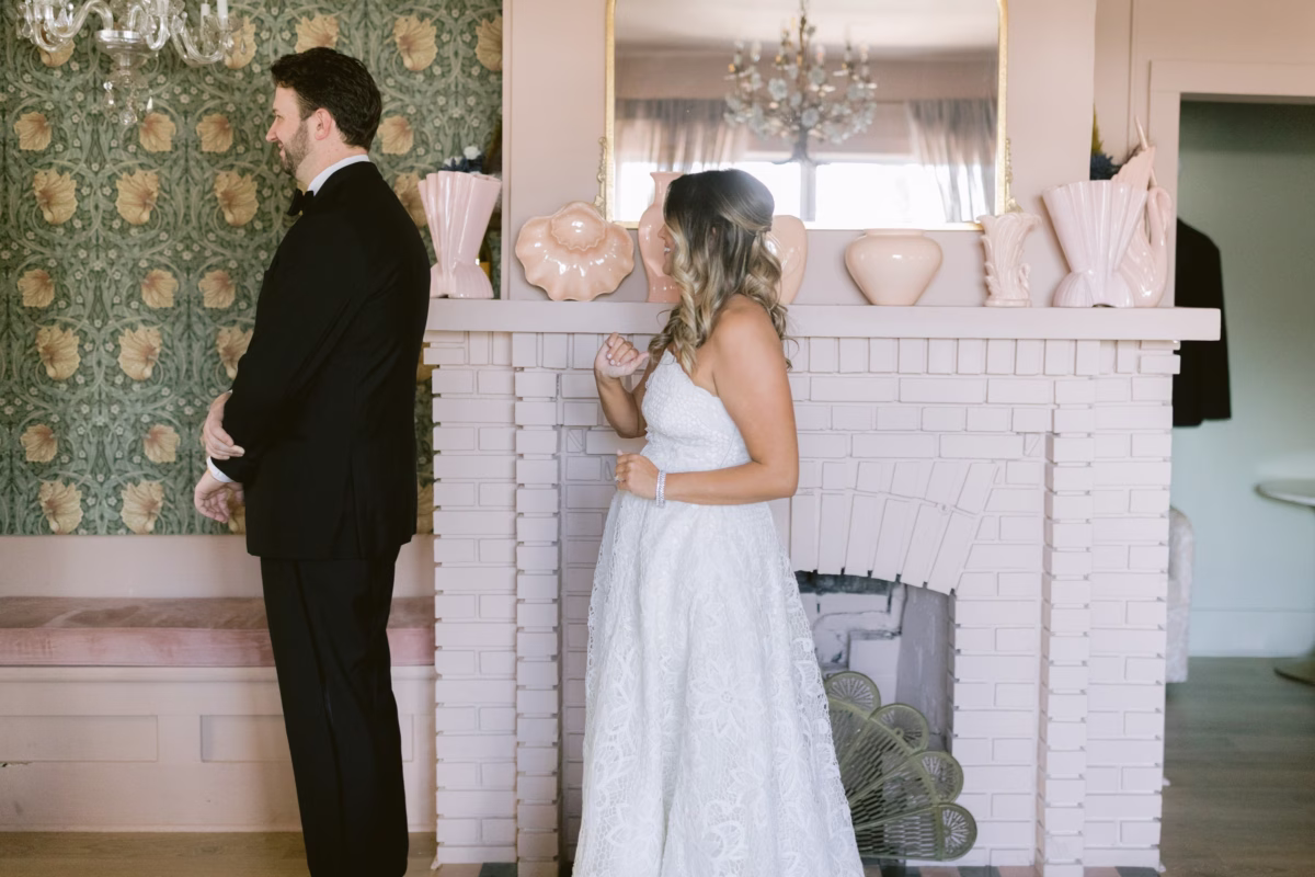 Bride and groom first look moment at Hostess House getting ready location coordinated by Day of Details wedding planning in St. Petersburg