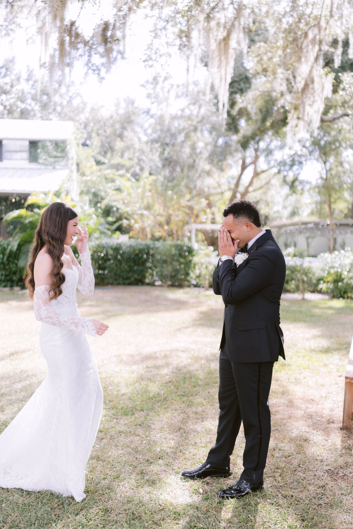 Emotional first look moment between bride and groom at Soire Estate Tampa wedding planned by Daniela Alvarez Event Planning