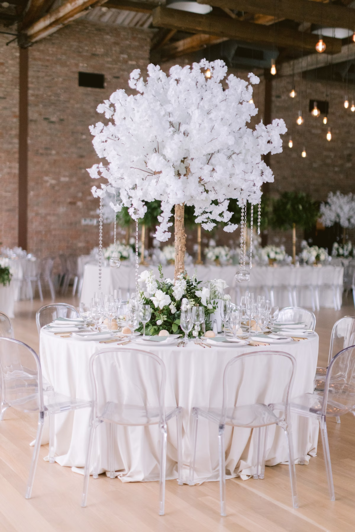 Elegant white floral centerpiece by Maky The Diva Flowers with hanging crystals at The Roundhouse Beacon Hudson Valley wedding venue