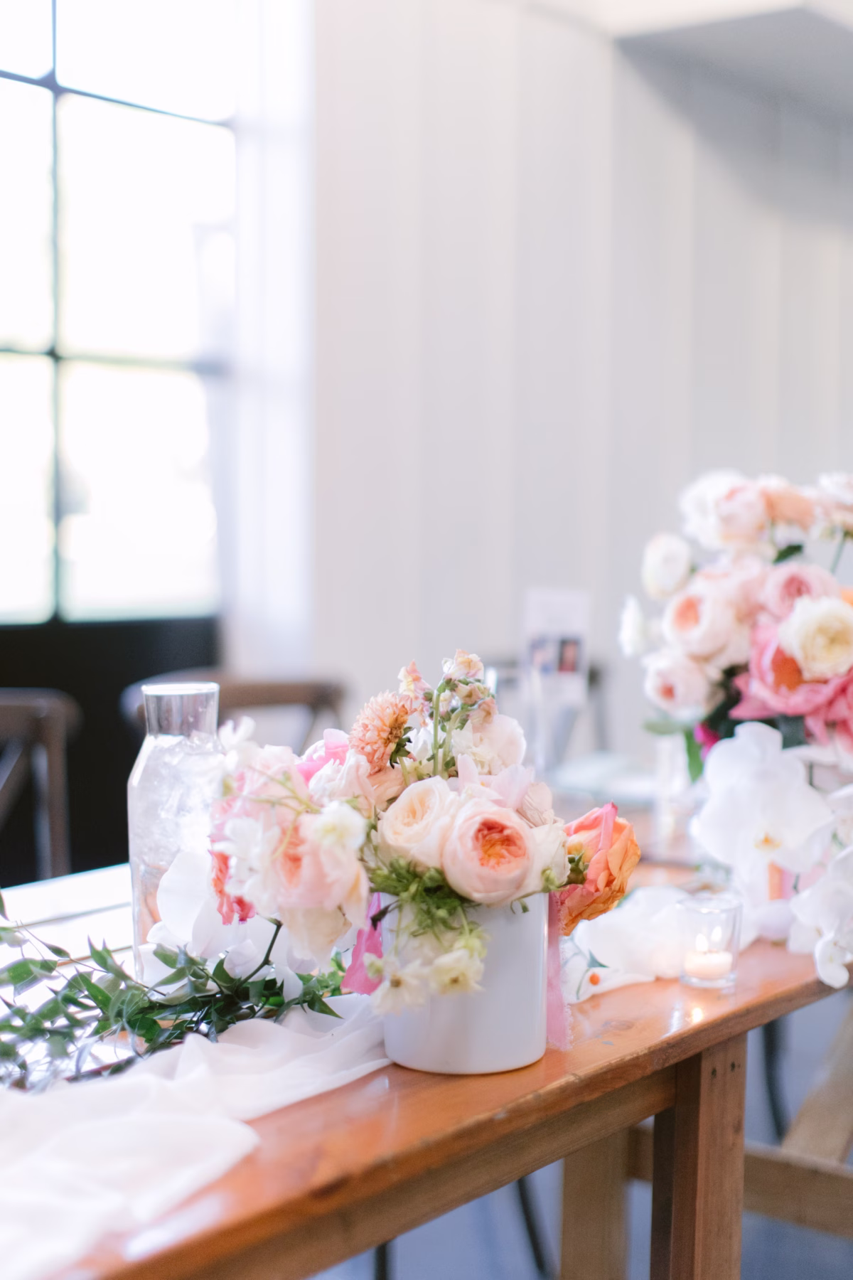 Romantic blush and peach wedding centerpieces by Golden Wild Florals at Soire Estate garden wedding in Tampa