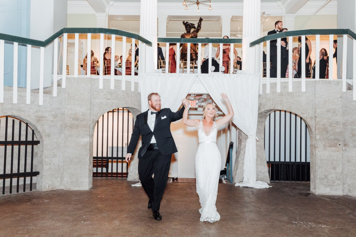 Bride and groom make grand entrance at historic Lightner Museum wedding planned by Coastal Celebrations