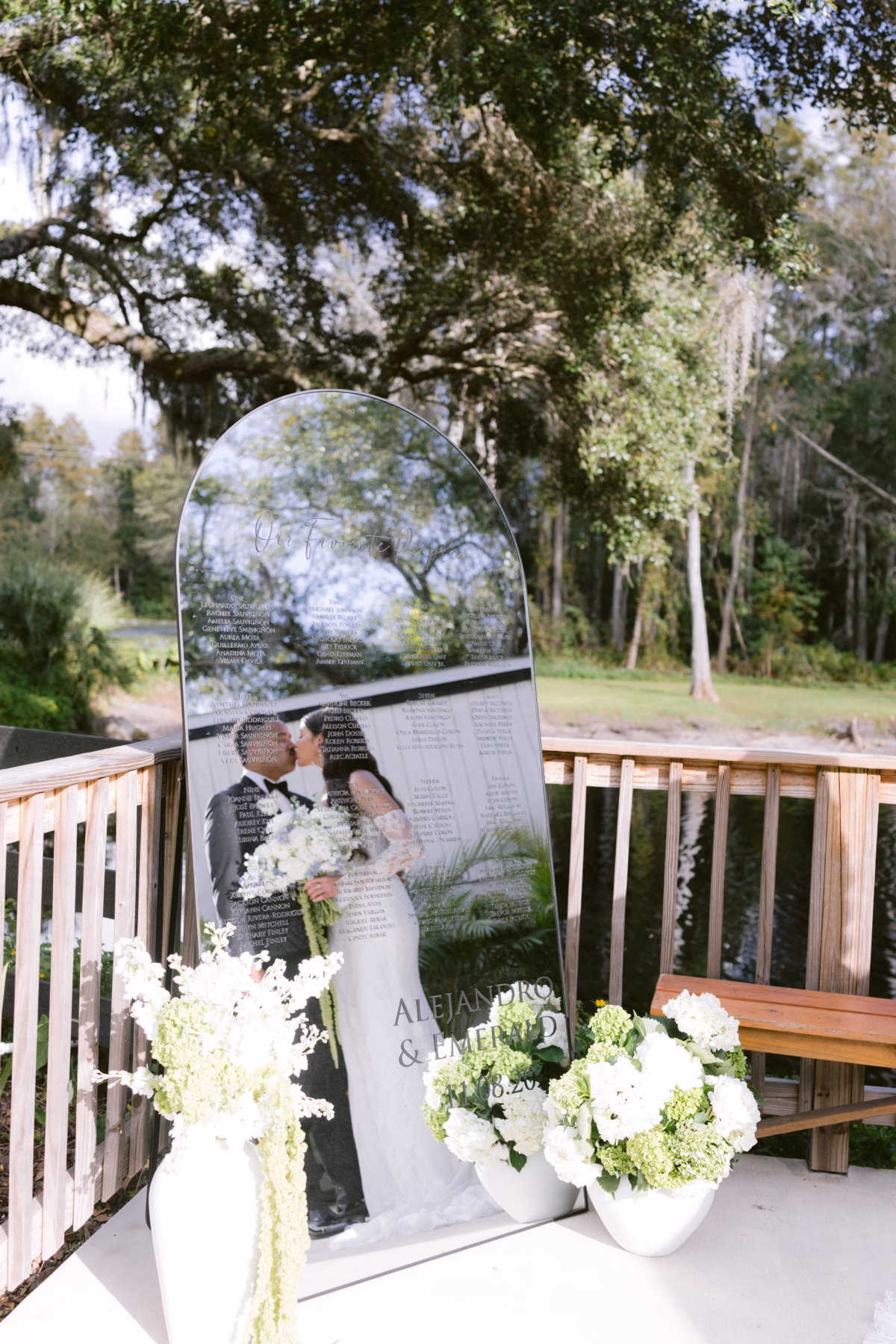 Elegant mirror seating chart with white hydrangea arrangements by Ava Elise Decor at Soire Estate Tampa wedding