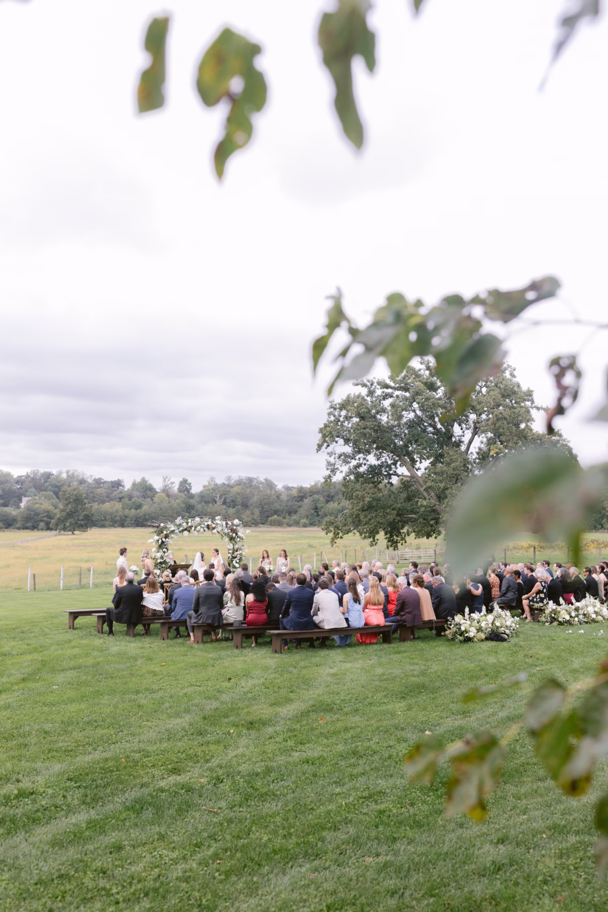 outdoor farm wedding ceremony johnsons locust hall new jersey - A Farm Wedding at Johnson's Locust Hall, New Jersey Outdoor wedding ceremony at Johnson's Locust Hall farm venue in New Jersey with guests seated on wooden benches overlooking green fields