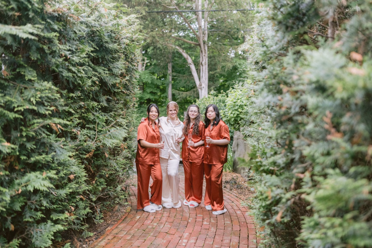 Bride and bridesmaids in silk pajamas during getting ready photos at Red Maple Vineyard wedding by Tampa Bay photographer Ashley Izquierdo Photography