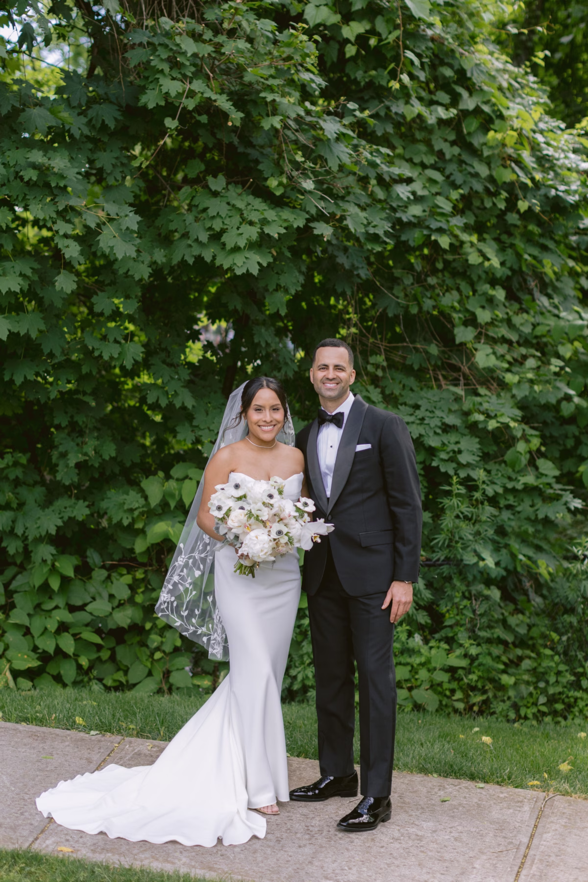 Elegant bride and groom portrait with white floral bouquet by Maky The Diva Flowers at The Roundhouse Beacon Hudson Valley wedding venue