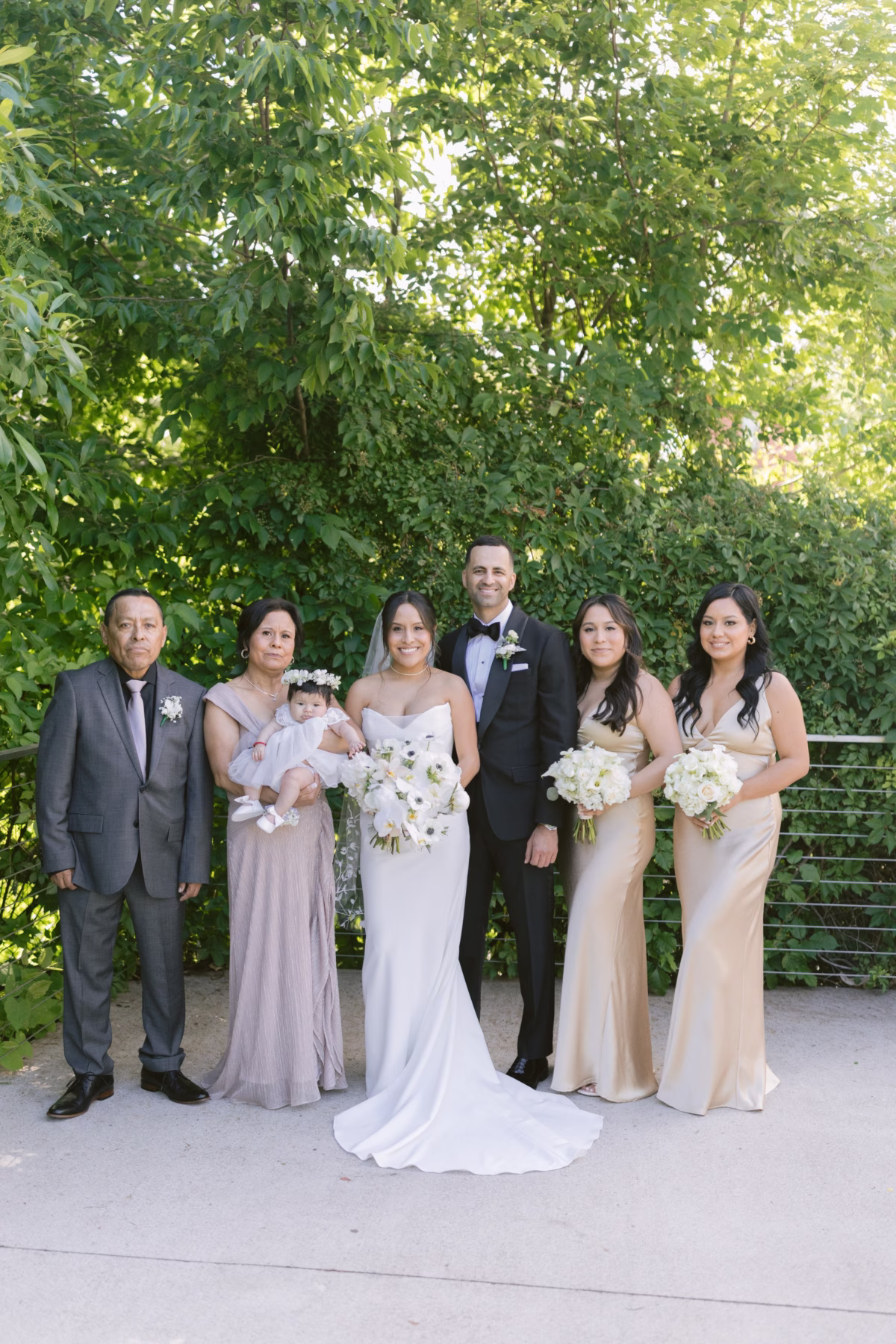 Wedding family portrait with white bouquets by Maky The Diva Flowers at The Roundhouse Beacon venue in Hudson Valley