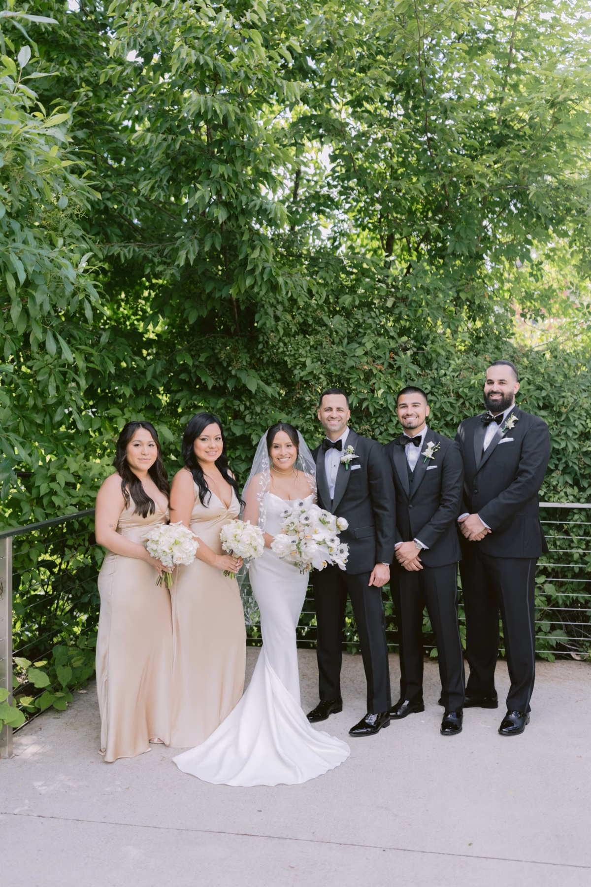 Wedding party portrait with white bouquets by Maky The Diva Flowers at The Roundhouse Beacon in Hudson Valley