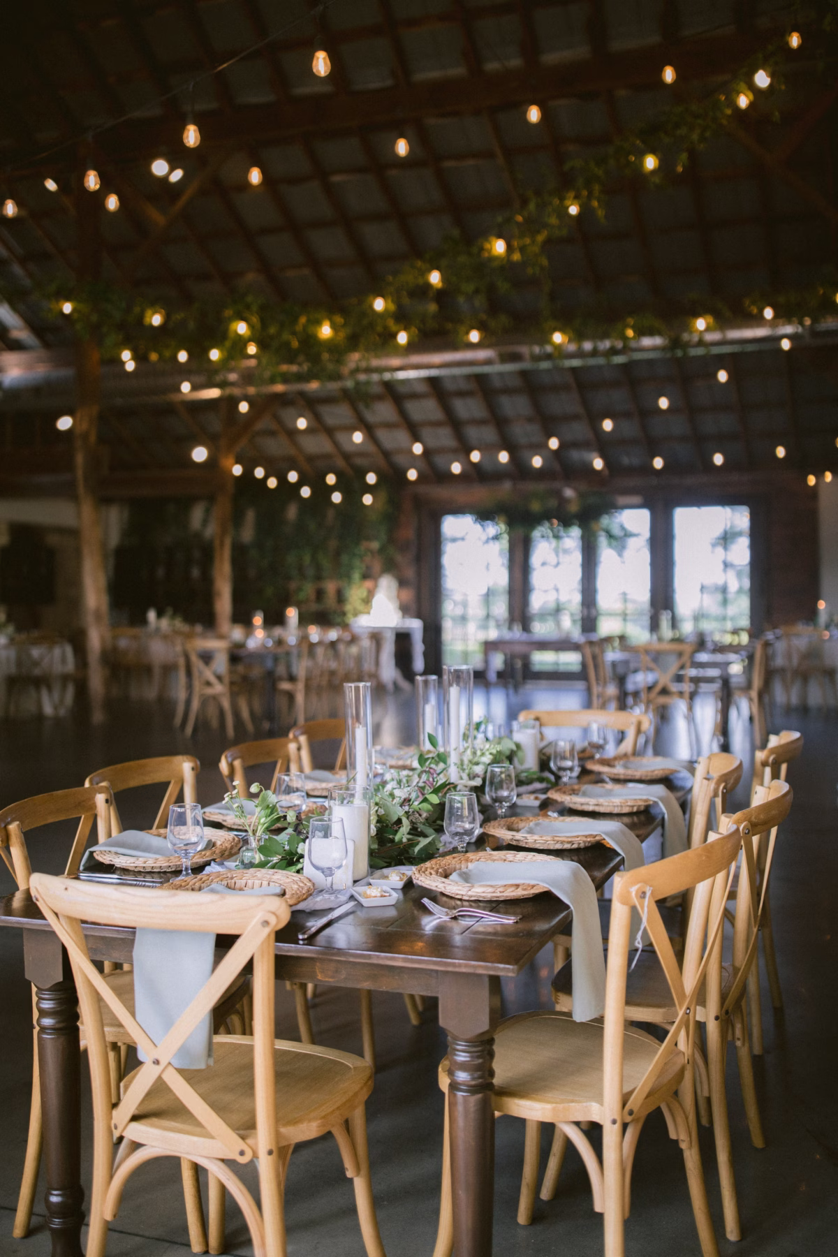 rustic wedding reception johnsons locust hall olive shae planning - A Farm Wedding at Johnson's Locust Hall, New Jersey Rustic wedding reception tablescape with string lights and natural greenery at Johnson's Locust Hall planned by Olive and Shae