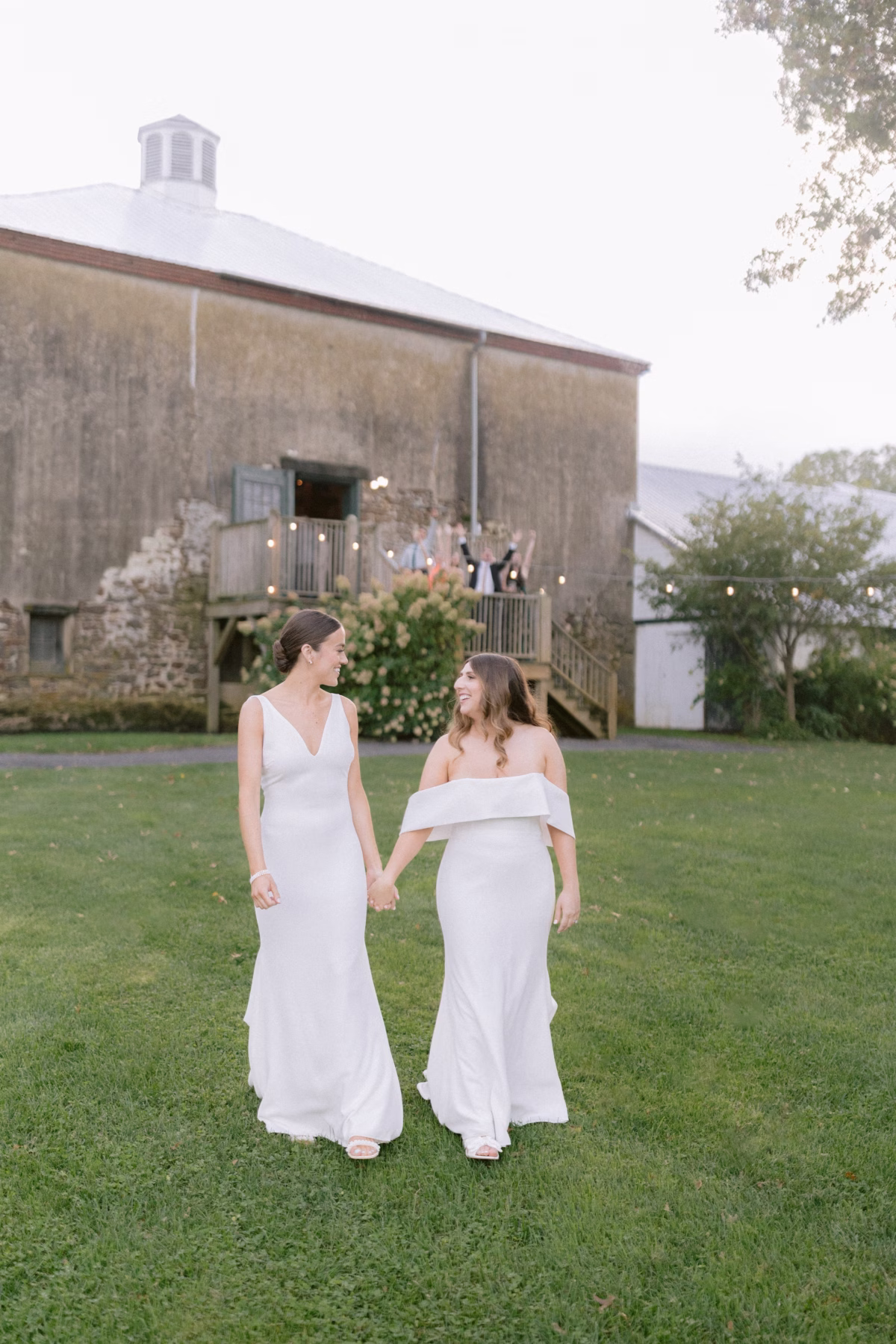 same sex farm wedding johnsons locust hall new jersey - A Farm Wedding at Johnson's Locust Hall, New Jersey Two brides in white gowns walking hand in hand at their farm wedding at Johnson's Locust Hall in New Jersey