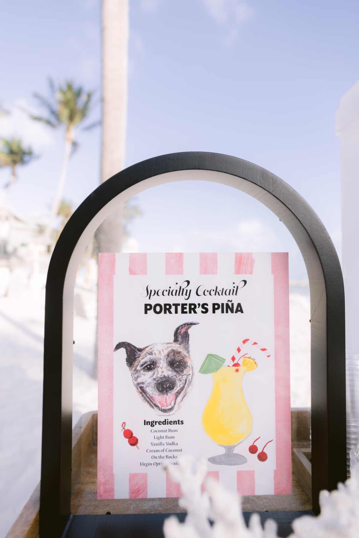 Specialty cocktail menu featuring Porter's Pina displayed at Casa Marina Key West wedding reception