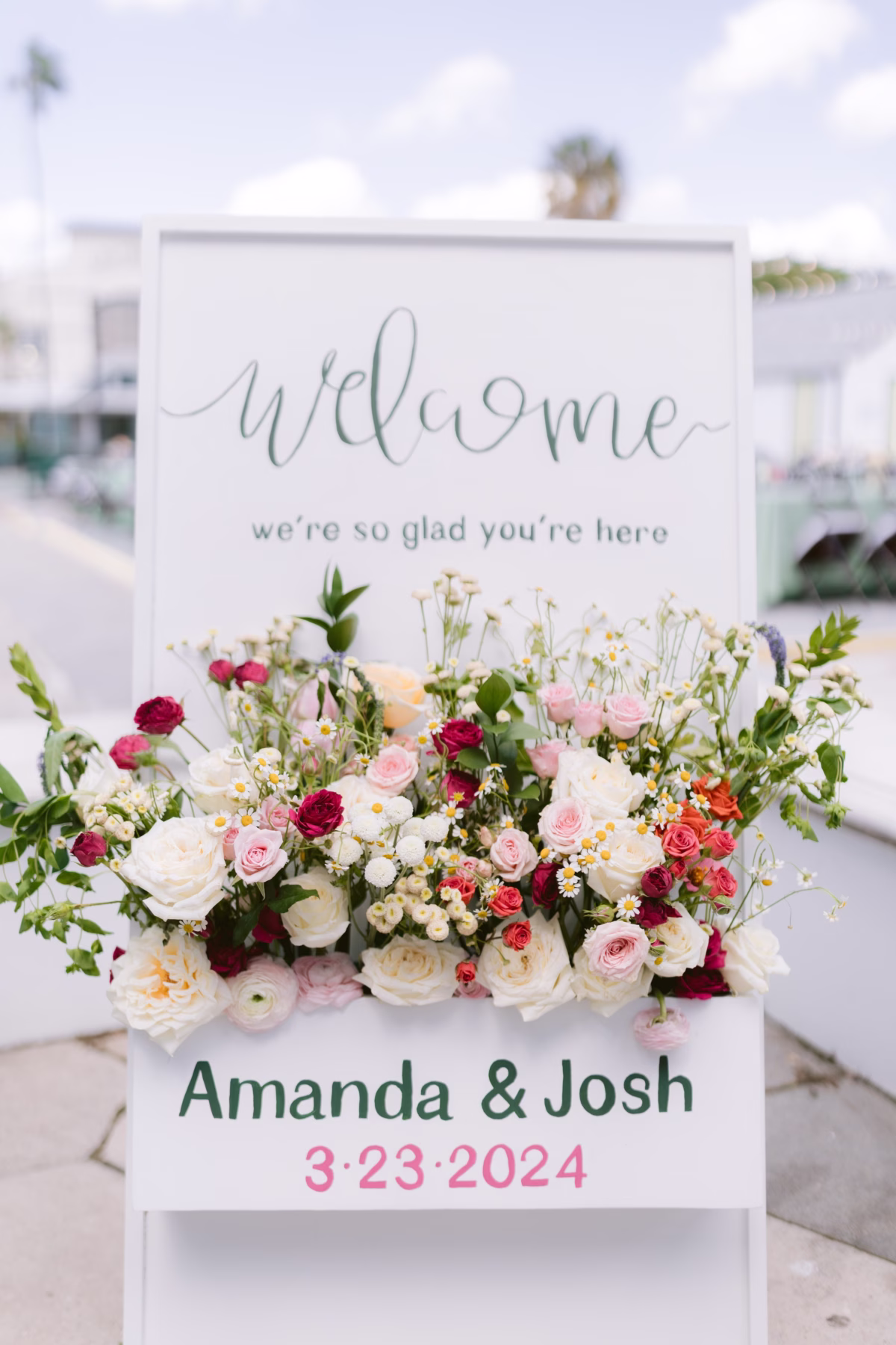 Welcome wedding sign with colorful floral arrangement by Petite Fleur at St Pete Shuffleboard Club captured by Ashley Izquierdo Photography