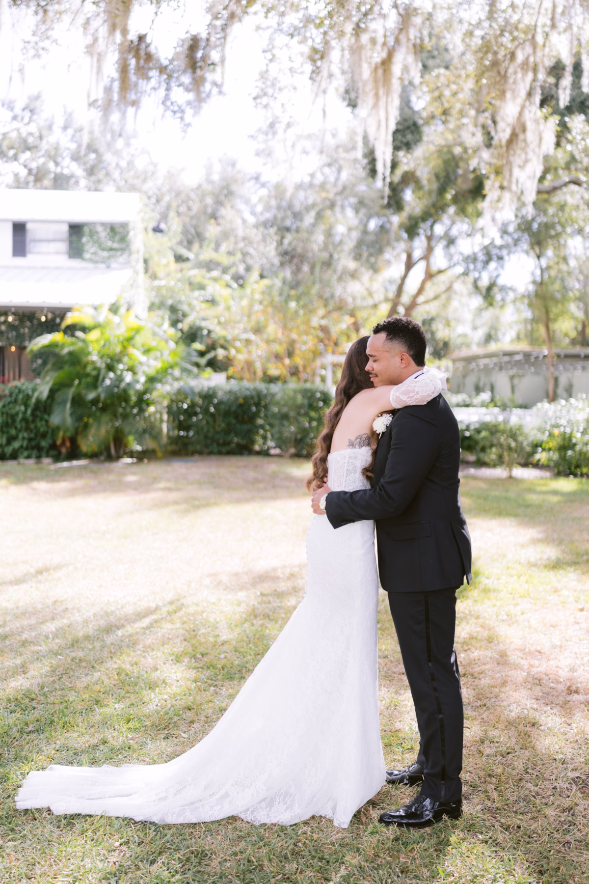 Bride and groom embrace in romantic moment at Soire Estate Tampa wedding captured by Ashley Izquierdo Photography