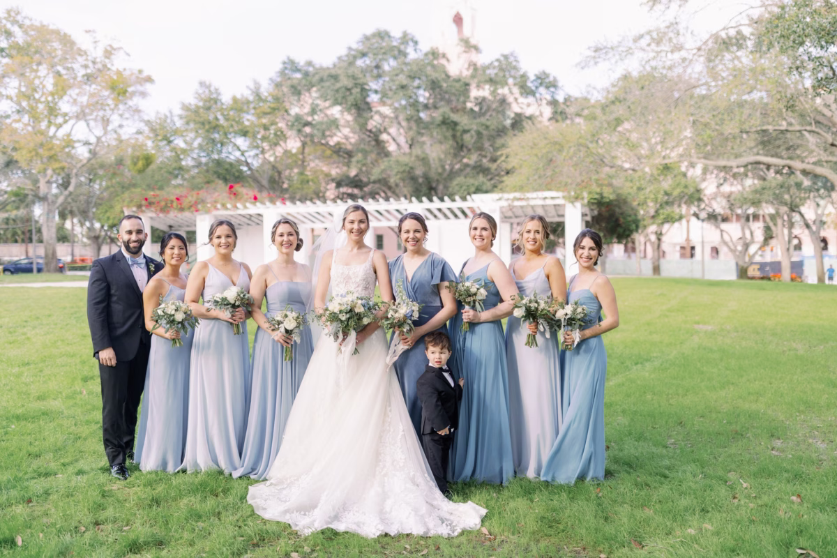 Bridal party with blue bridesmaid dresses and white bouquets at The Vinoy St. Petersburg wedding planned by Lemon Drops Weddings and Events