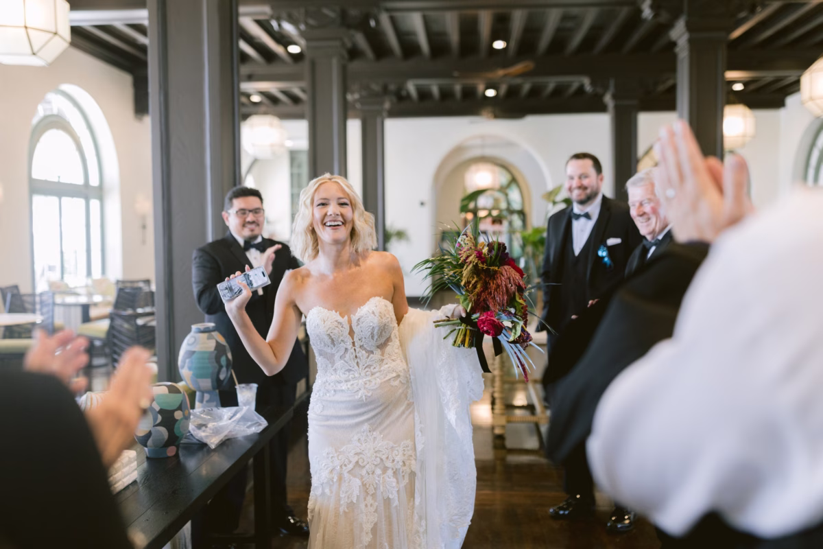 Bride and groom celebrating with guests at Casa Marina Key West wedding reception captured by Ashley Izquierdo Photography