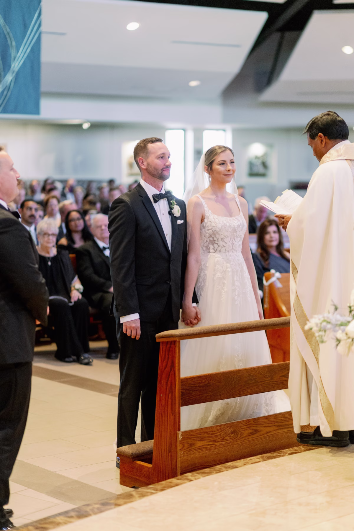 Bride and groom holding hands during wedding ceremony at The Vinoy St. Petersburg with wedding planning by Lemon Drops Weddings and Events