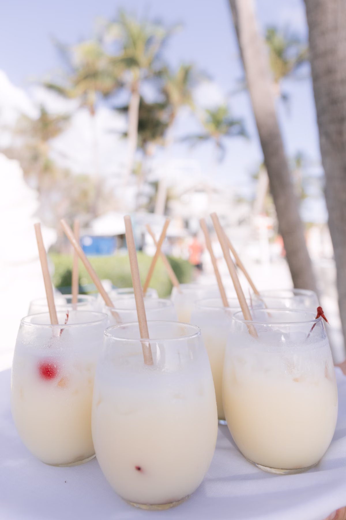 Elegant wedding cocktails with wooden straws served at Casa Marina Key West styled by Oak and Ash Events