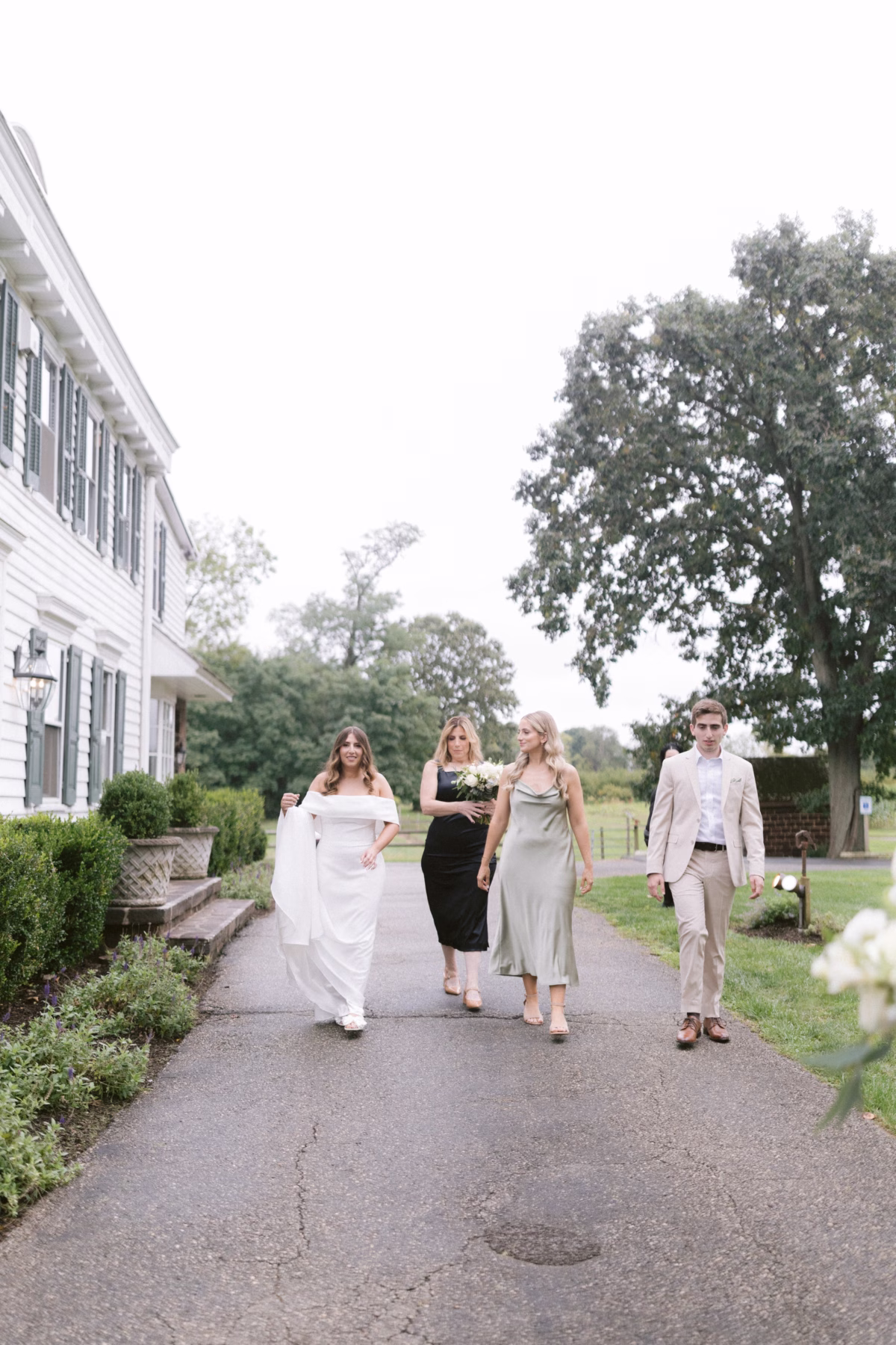 wedding party walking johnsons locust hall farm wedding - A Farm Wedding at Johnson's Locust Hall, New Jersey Wedding party walking down pathway at Johnson's Locust Hall farm wedding venue in New Jersey photographed by Ashley Izquierdo Photography