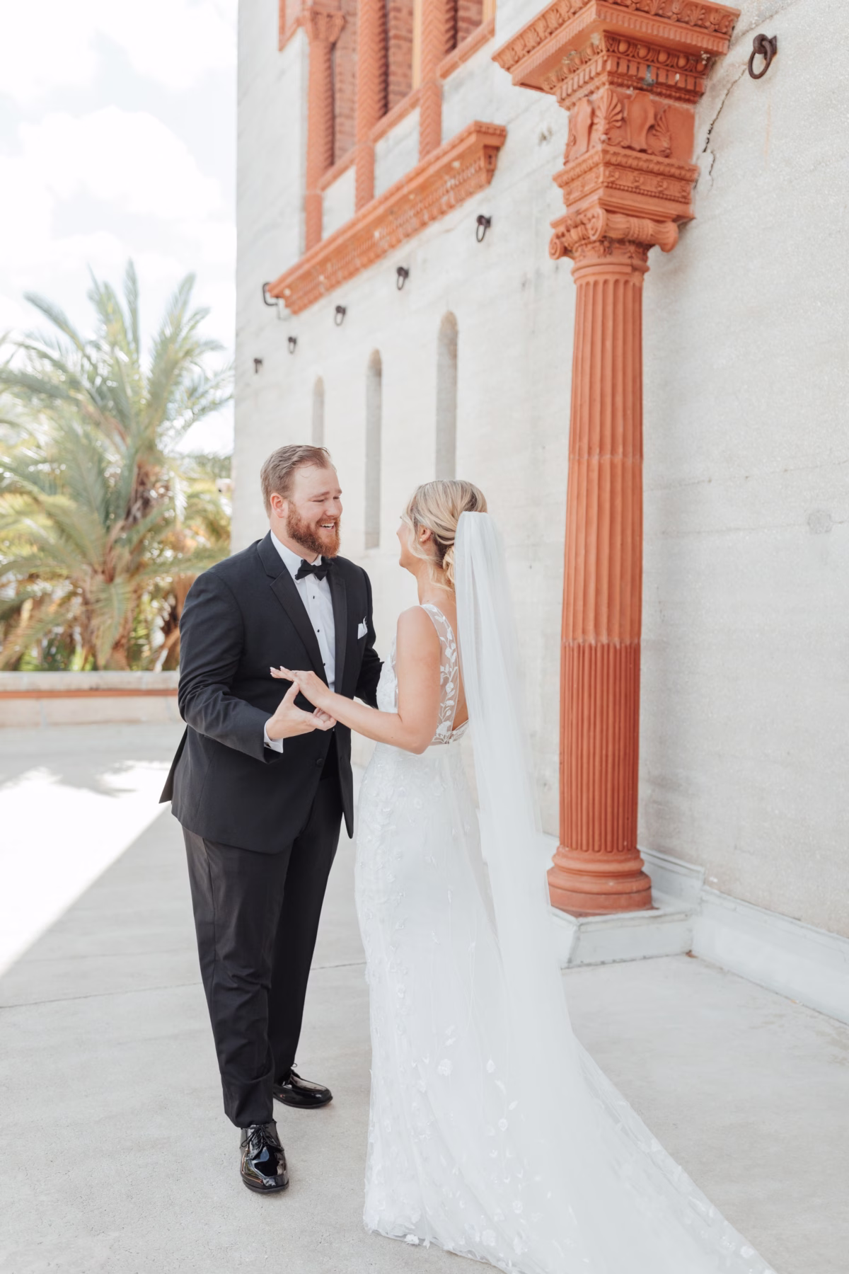 Bride and groom first look moment at The Lightner Museum coordinated by Coastal Celebrations wedding planning in St. Augustine
