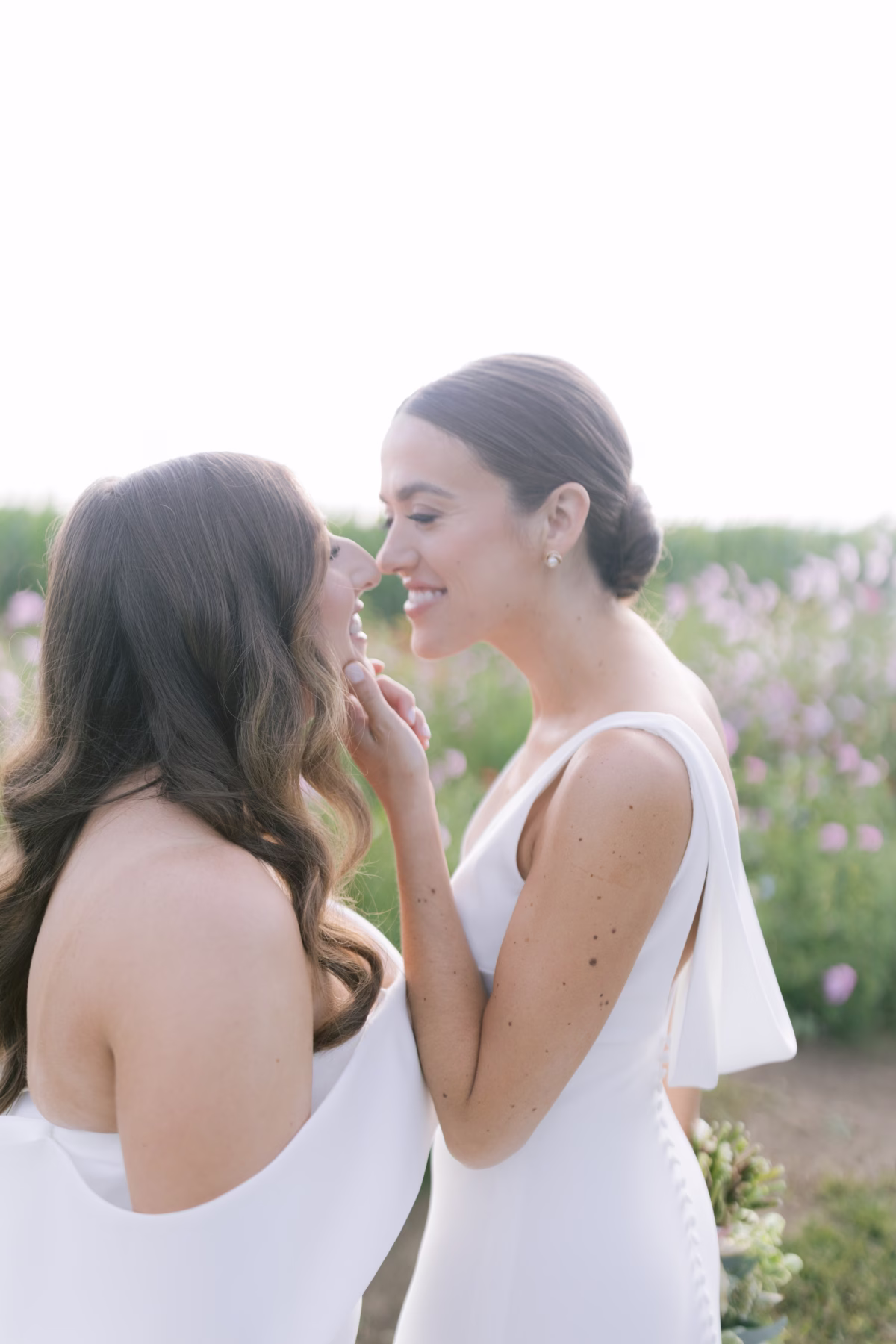 wedding planning olive and shae johnsons locust hall lgbtq couple intimate moment - A Farm Wedding at Johnson's Locust Hall, New Jersey Two brides in white dresses share an intimate moment at Johnson's Locust Hall farm wedding planned by Olive and Shae in New Jersey
