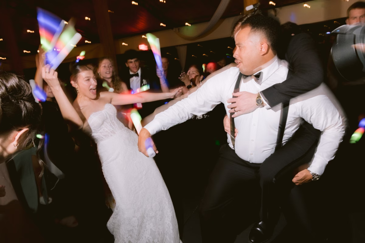 Bride and groom dancing with colorful glow sticks at Soire Estate wedding reception in Tampa