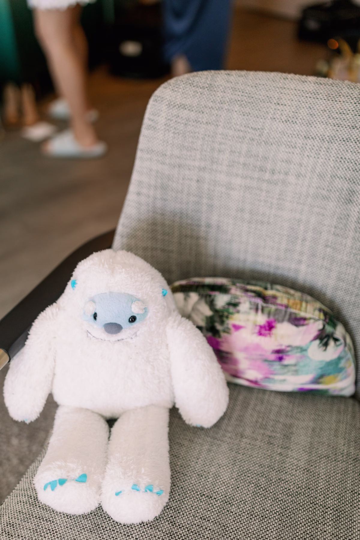 Wedding reception chair detail with stuffed animal and colorful pillow at The Vinoy St. Petersburg captured by Ashley Izquierdo Photography