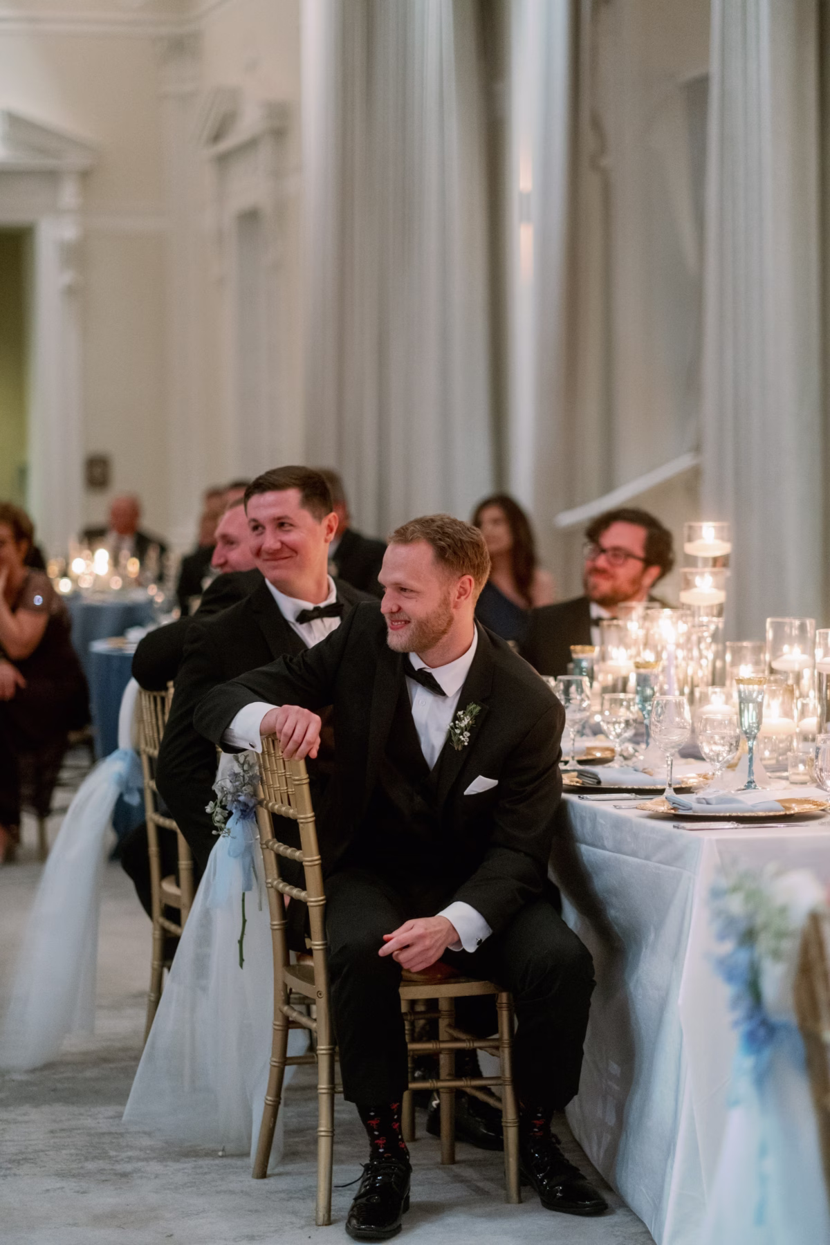 Groom and groomsmen laughing during elegant wedding reception at The Vinoy St Petersburg with planning by Lemon Drops Weddings and Events