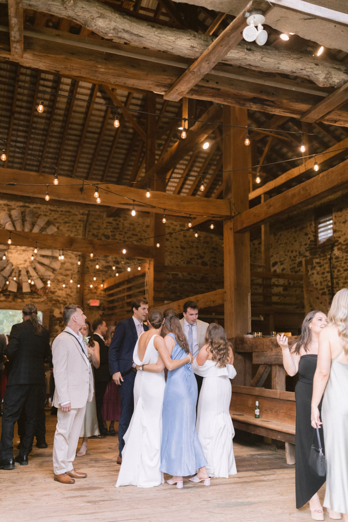 wedding reception johnsons locust hall rustic barn venue - A Farm Wedding at Johnson's Locust Hall, New Jersey Wedding reception in rustic barn with exposed beams and string lights at Johnson's Locust Hall farm venue in New Jersey