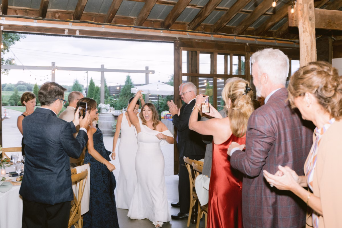 wedding reception toasts johnsons locust hall farm wedding - A Farm Wedding at Johnson's Locust Hall, New Jersey Wedding guests raising champagne glasses in celebration during reception toasts at Johnson's Locust Hall farm wedding venue in New Jersey