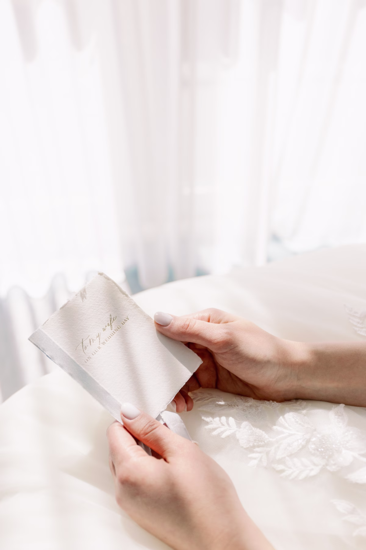 Bride reading romantic love note wedding stationery by Urban Coast at The Vinoy St. Petersburg waterfront wedding