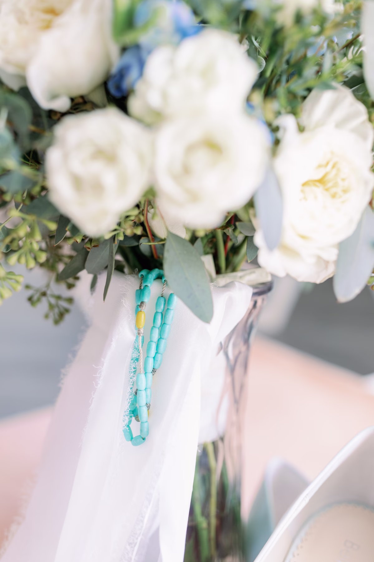 White rose bridal bouquet with turquoise beaded detail by Lemon Drops Weddings and Events at The Vinoy St. Petersburg waterfront wedding